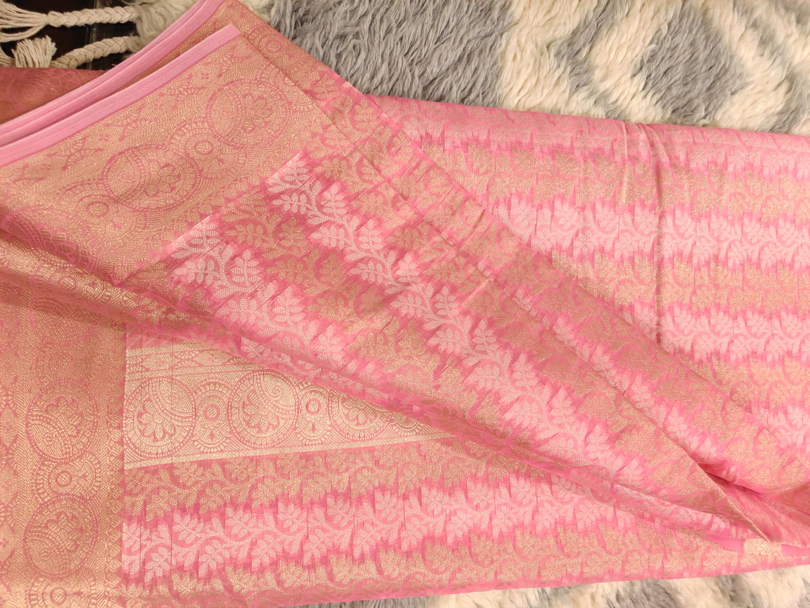 Golden pink banarasi chanderi saree with overall zari and thread work.