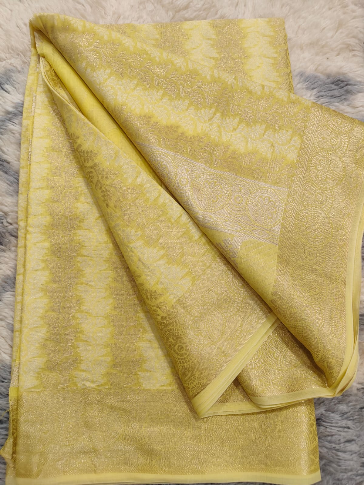 Golden yellow chanderi silk banarasi saree with overall zari thread weaving