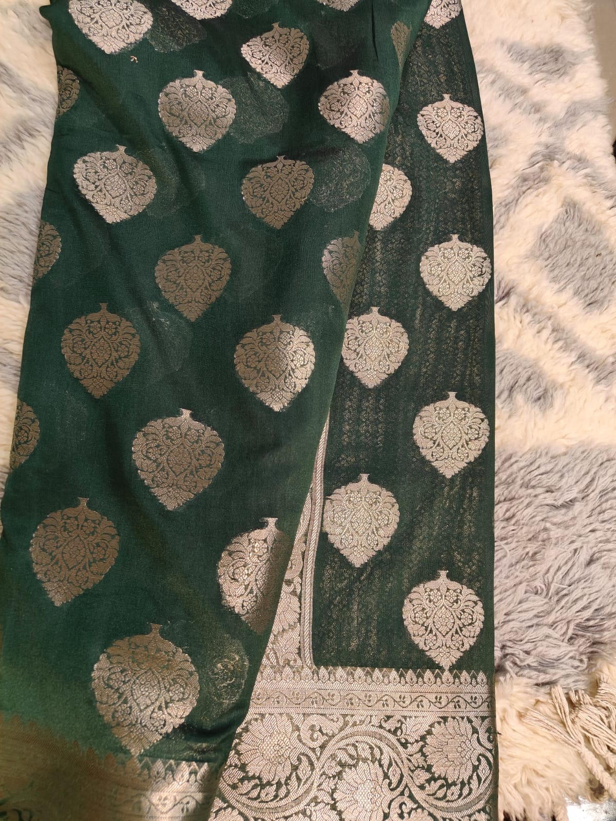 Dark mehdi green banarasi saree with silver zari pan boti pattern.lovely wedding piece.