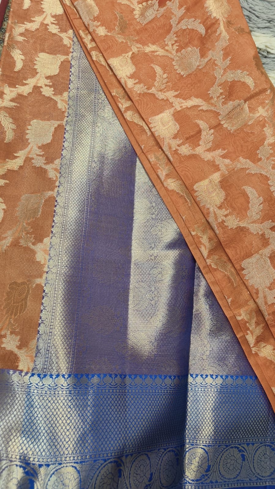 banarasi organza silk saree with golden zari jal work and blue pallu.