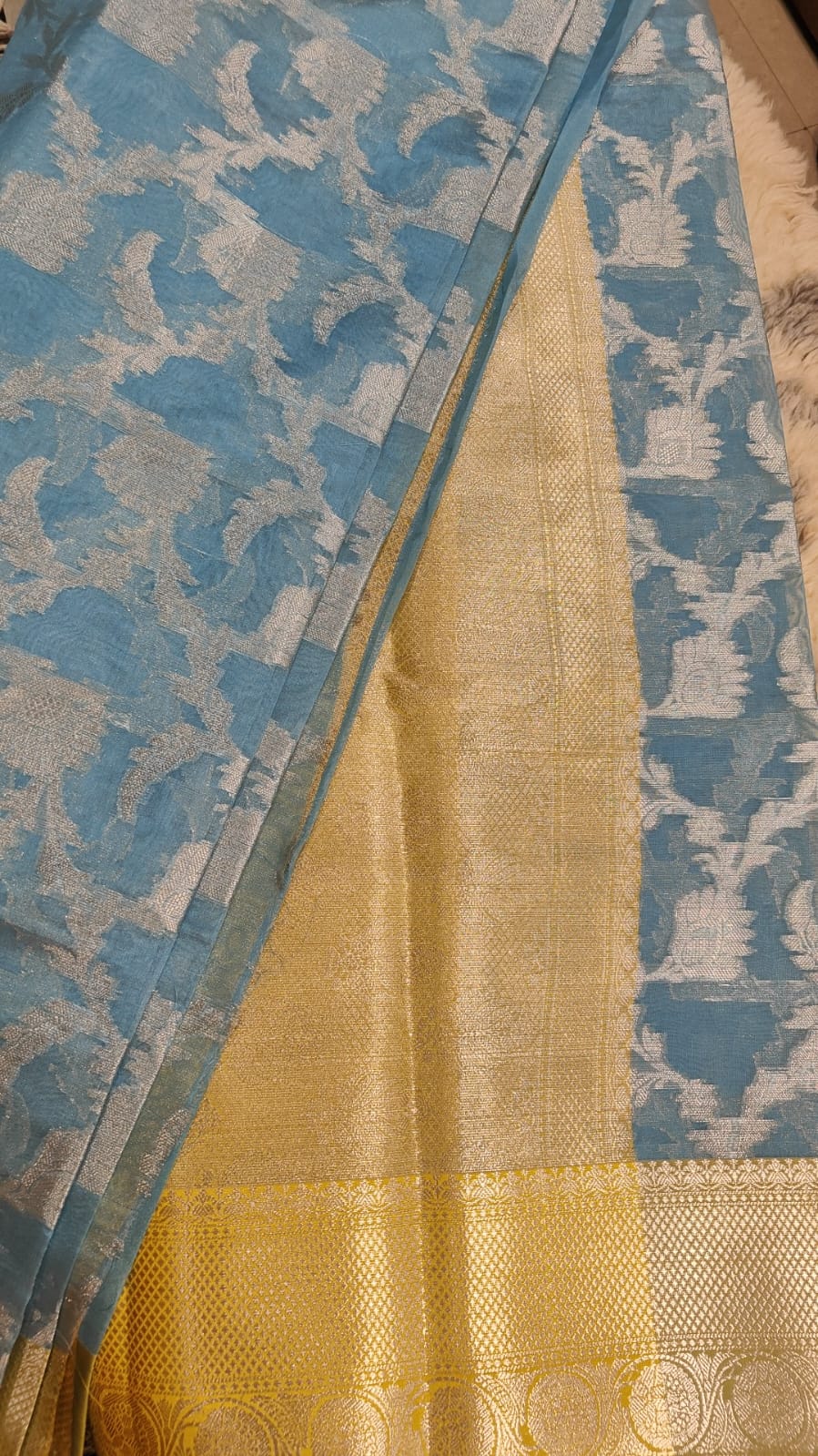 Banarasi blue organza silk saree with silver zari weaving jal and yellow pallu.